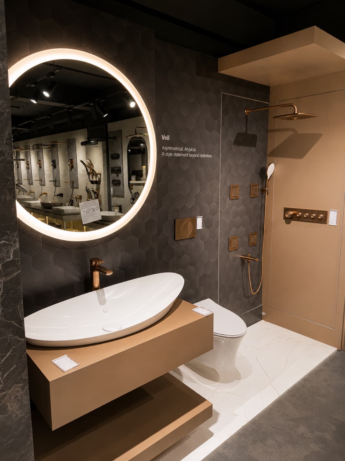 Kohler Veil suite with rose gold shower fittings, lighted mirror and oval vessel basin at Tayo Living, Gurgaon