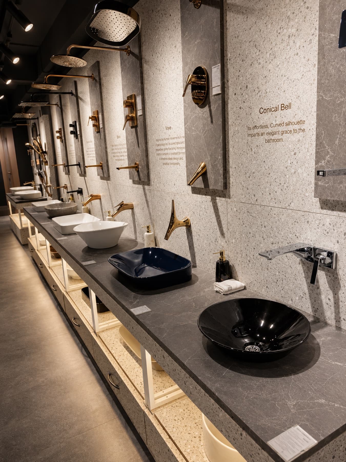 Kohler Vove and Conical Bell faucet displays with coloured vessel basins at Tayo Living, Gurgaon