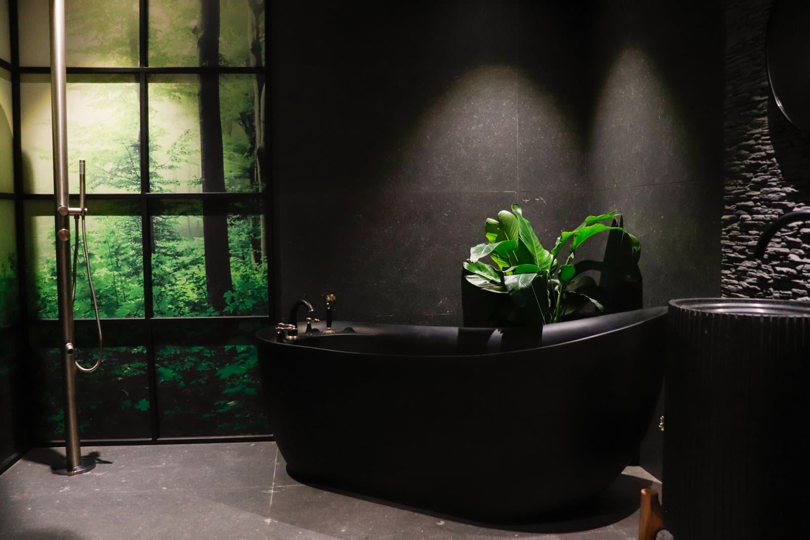Freestanding bathtub in a dark designer suite